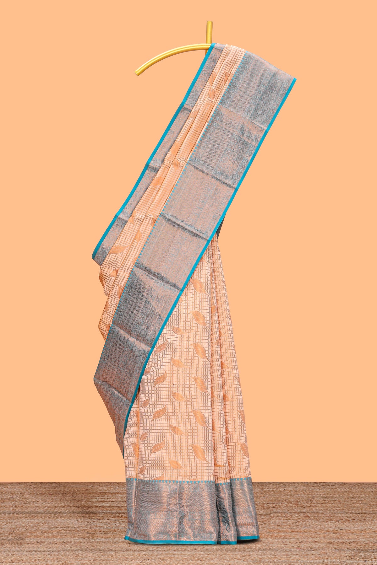 Peach checked leaf zari motifs design semi soft silk saree with contrast zari border and blouse