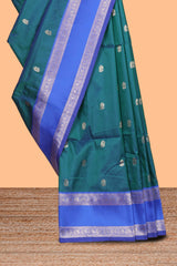 Peacock green Semi Soft Silk Saree delicate butta motifs with contrasting pallu elegant zari border along with contrast buttas blouse