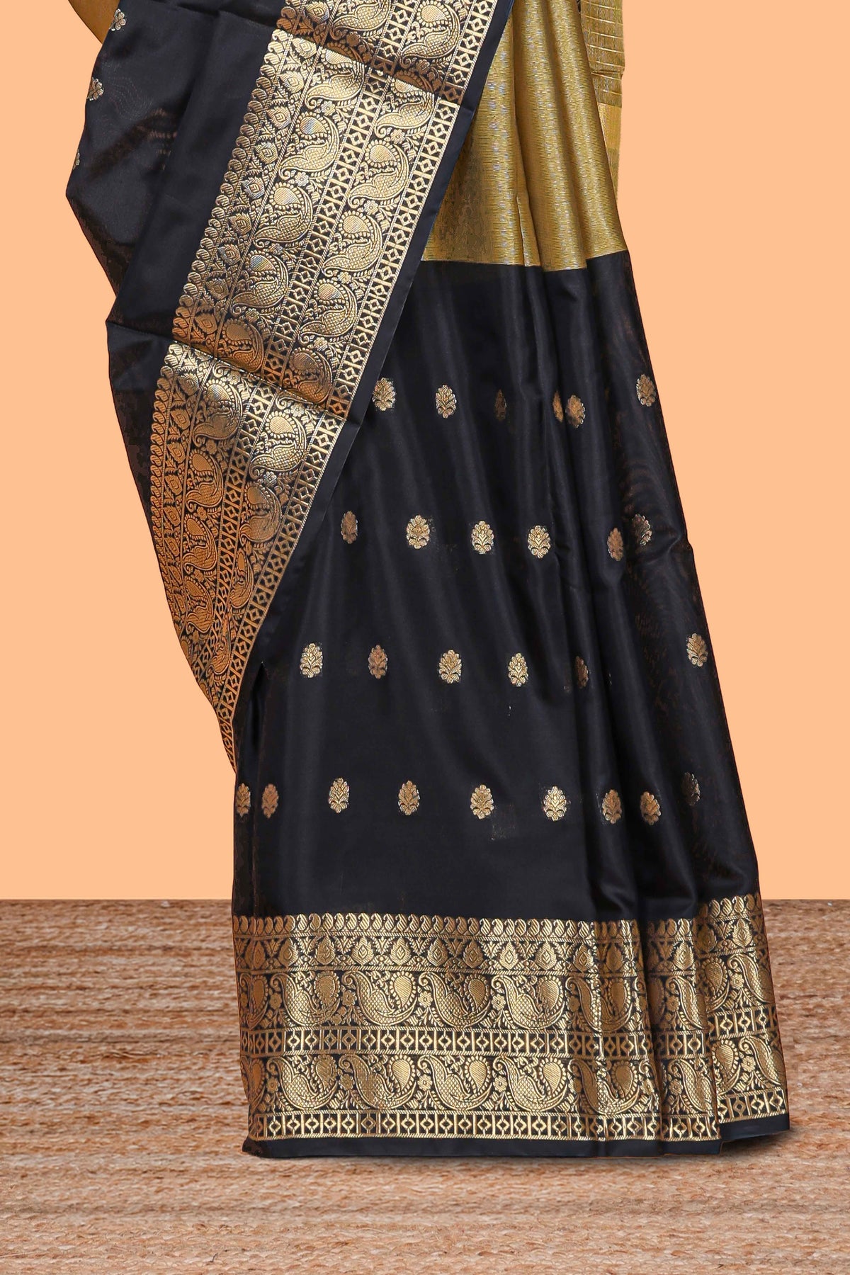 Black Semi Soft Silk Saree butta detailing rich gold zari borders traditional paisley motifs along with matching blouse