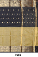 Black Semi Soft Silk Saree butta detailing rich gold zari borders traditional paisley motifs along with matching blouse