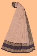 Peach checked floral zari motifs design semi soft silk saree with contrast border and zari blouse