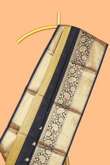 Black floral butta detailed Semi Soft Silk Saree with rich gold floral zari borders along with matching blouse