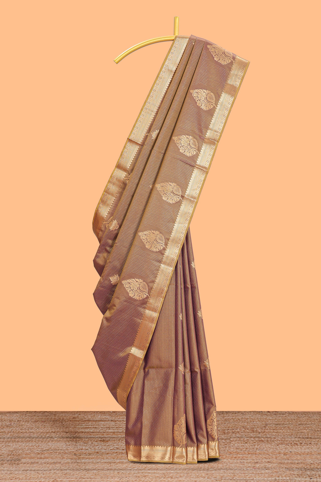 Brown floral design motifs semi soft silk saree with contrast border and blouse