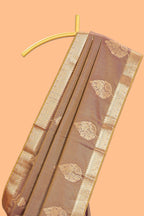 Brown floral design motifs semi soft silk saree with contrast border and blouse