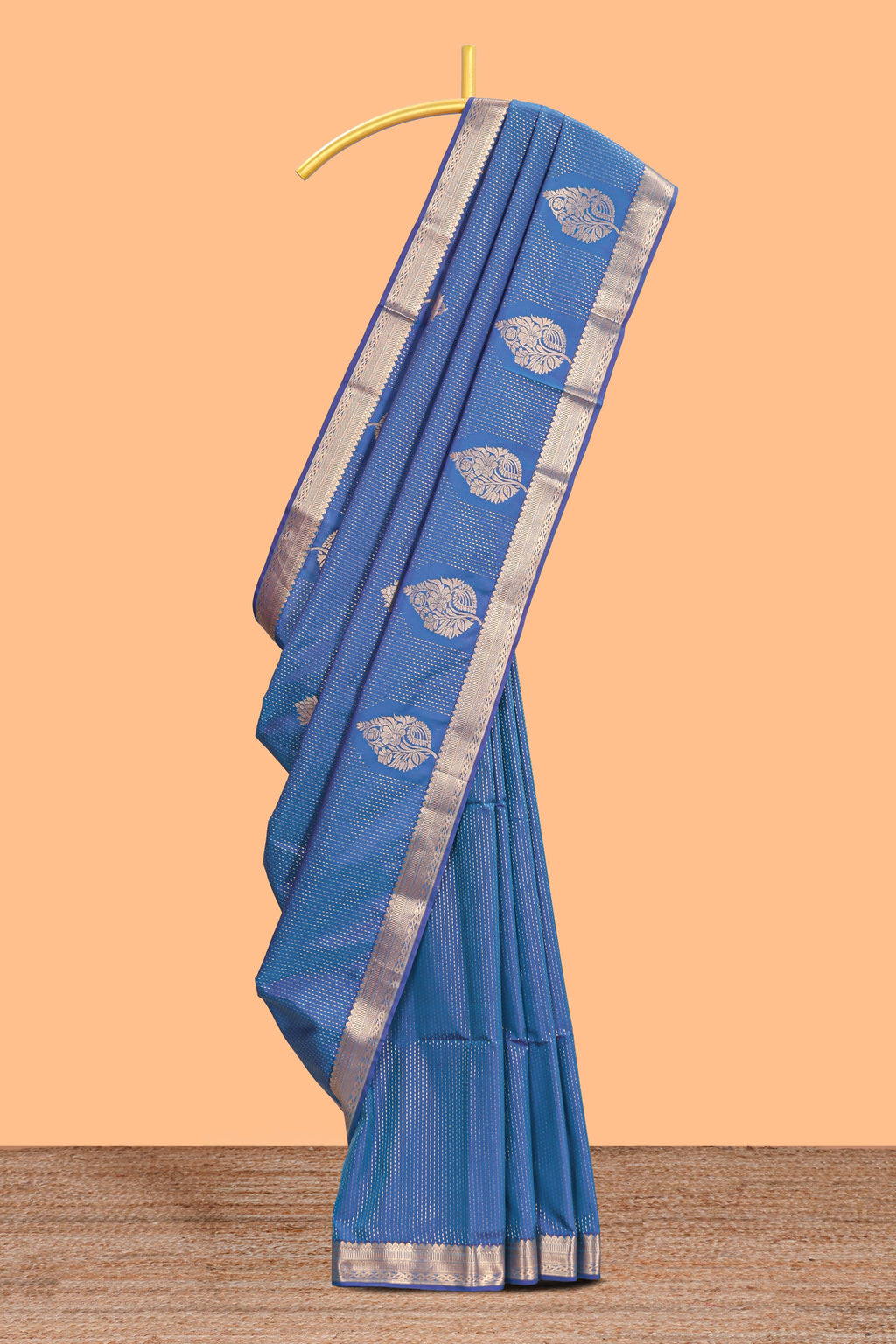Blue floral design motifs semi soft silk saree with self border and contrast blouse