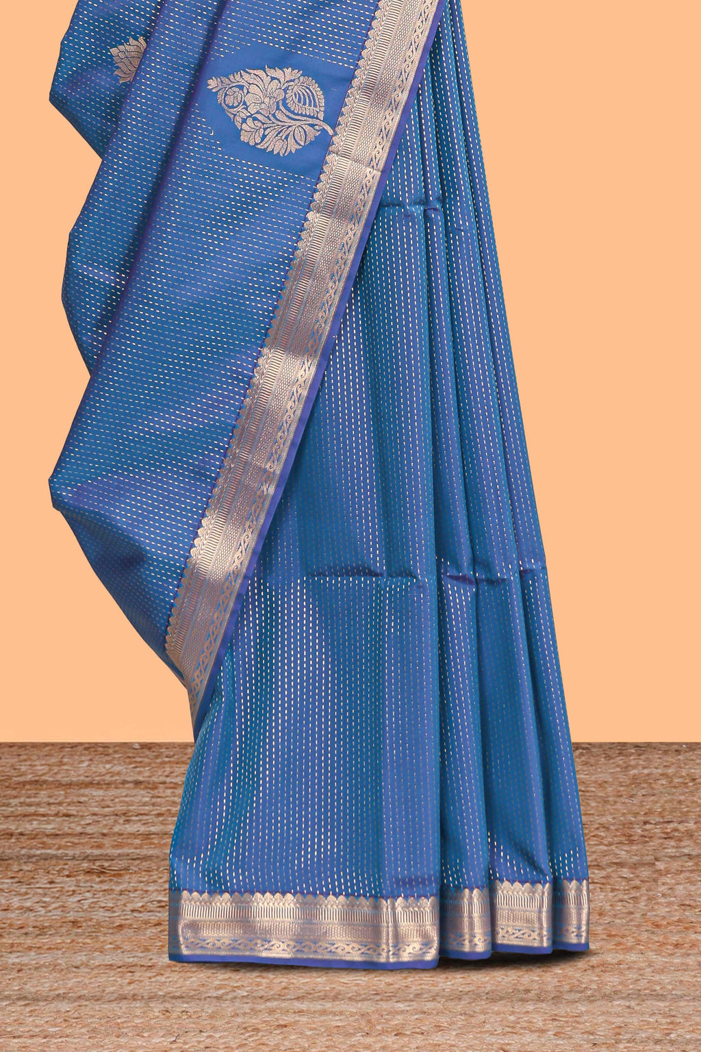Blue floral design motifs semi soft silk saree with self border and contrast blouse