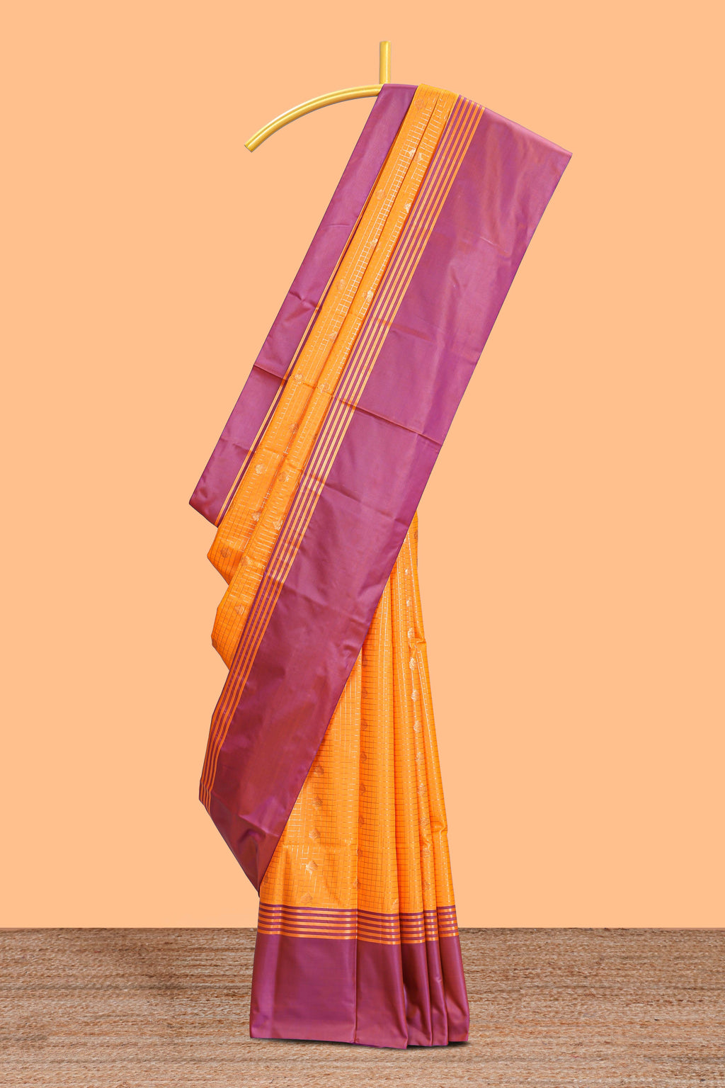 Orange checked floral design motifs semi soft silk saree with contrast border and blouse