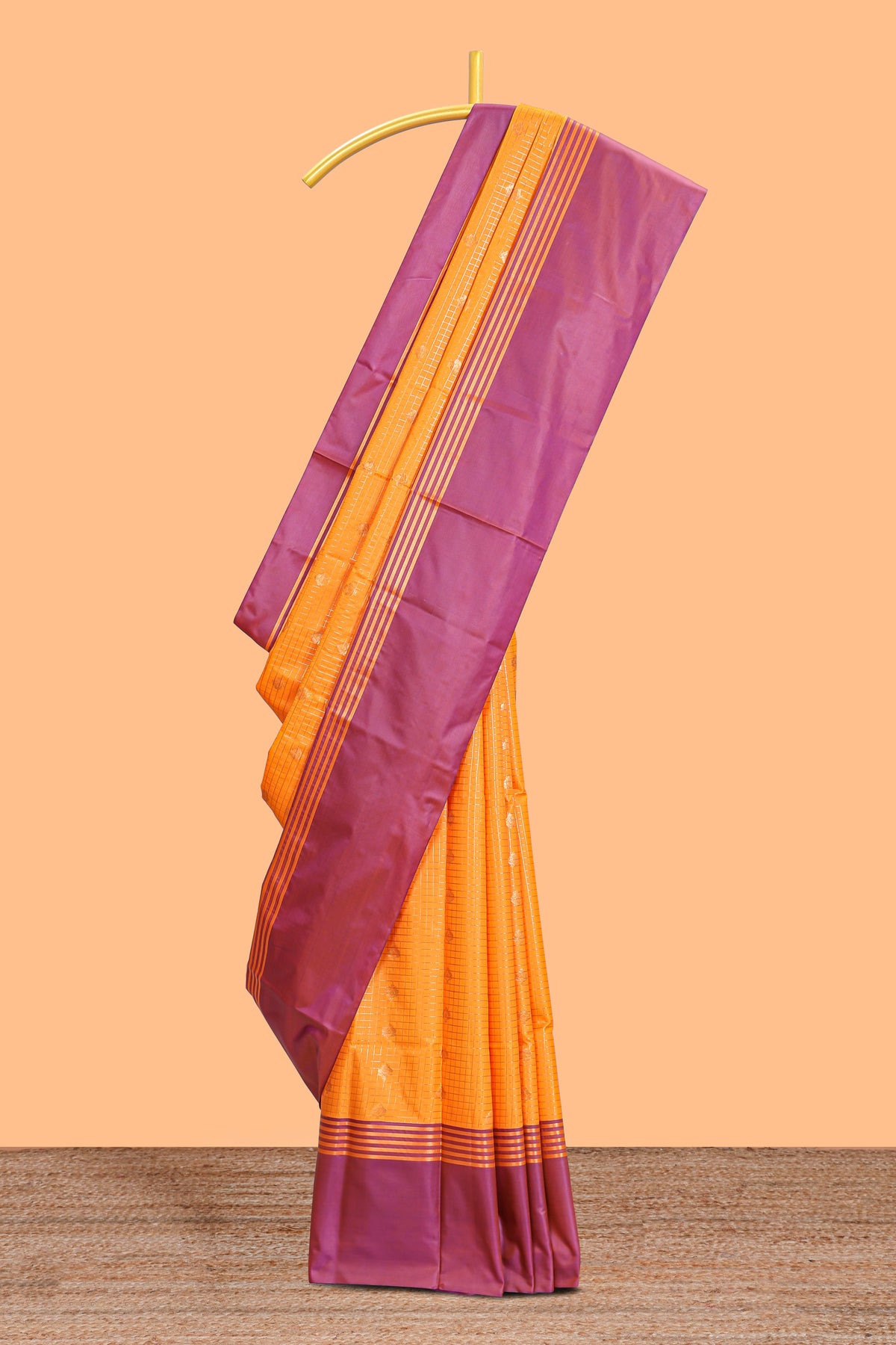 Orange checked floral design motifs semi soft silk saree with contrast border and blouse