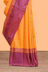 Orange checked floral design motifs semi soft silk saree with contrast border and blouse