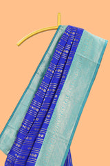 Blule striped and butta detailed Semi Soft Silk Saree with contrast teal blue zari border along with contrasting blouse