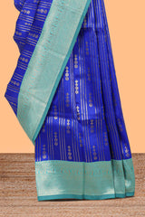 Blule striped and butta detailed Semi Soft Silk Saree with contrast teal blue zari border along with contrasting blouse