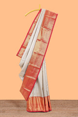 Cream shade checked butta design Semi Soft Silk Saree with contrast zari border along with contrasting blouse