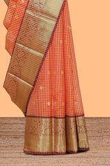 Orange and pink checked zari motifs semi soft silk saree with contrast zari border and motifs blouse