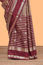 Maroon striped floral zari motifs design semi soft silk saree with self zari border and matching striped blouse