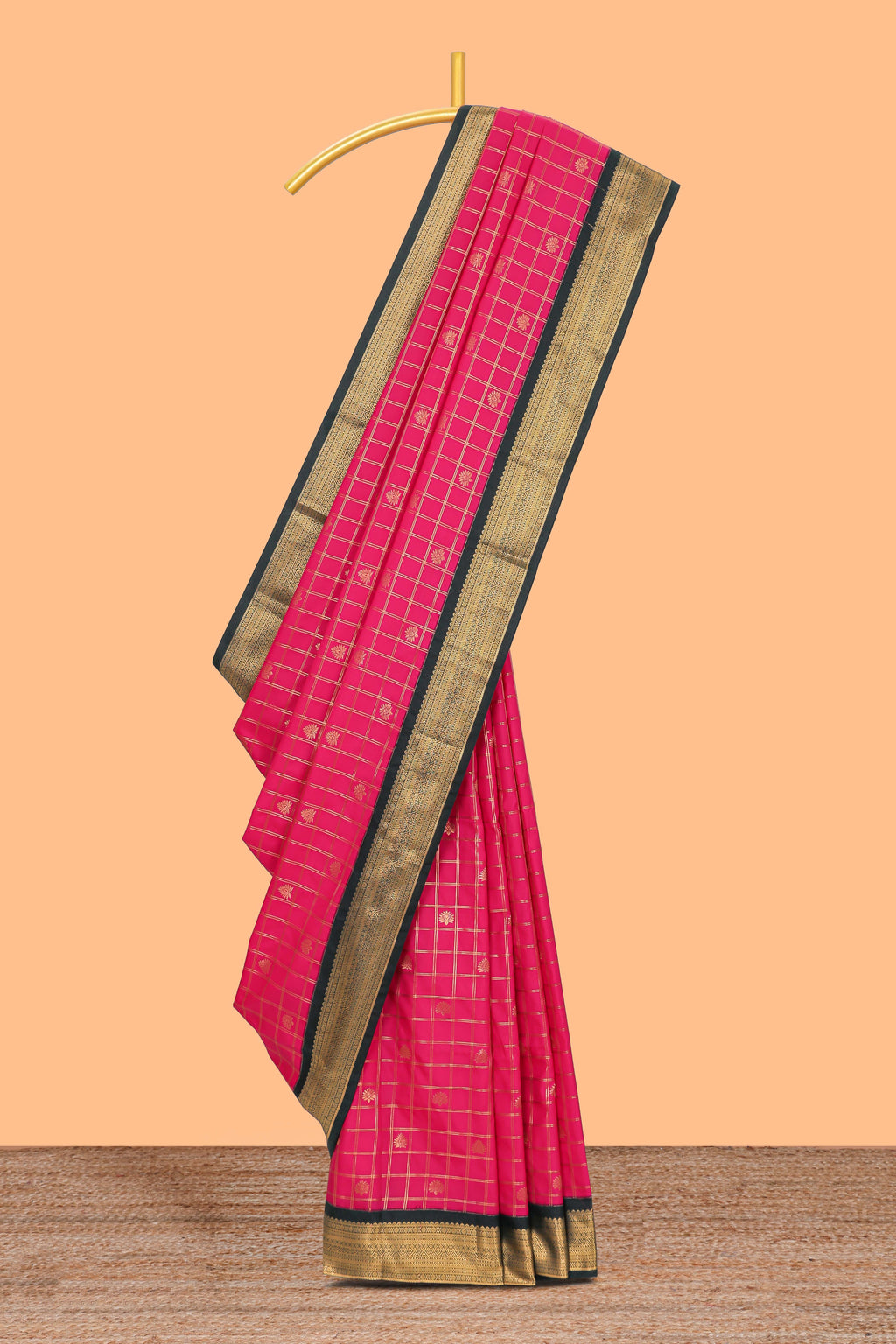 Pink checked floral motifs design semi soft silk saree with contrast border and striped blouse