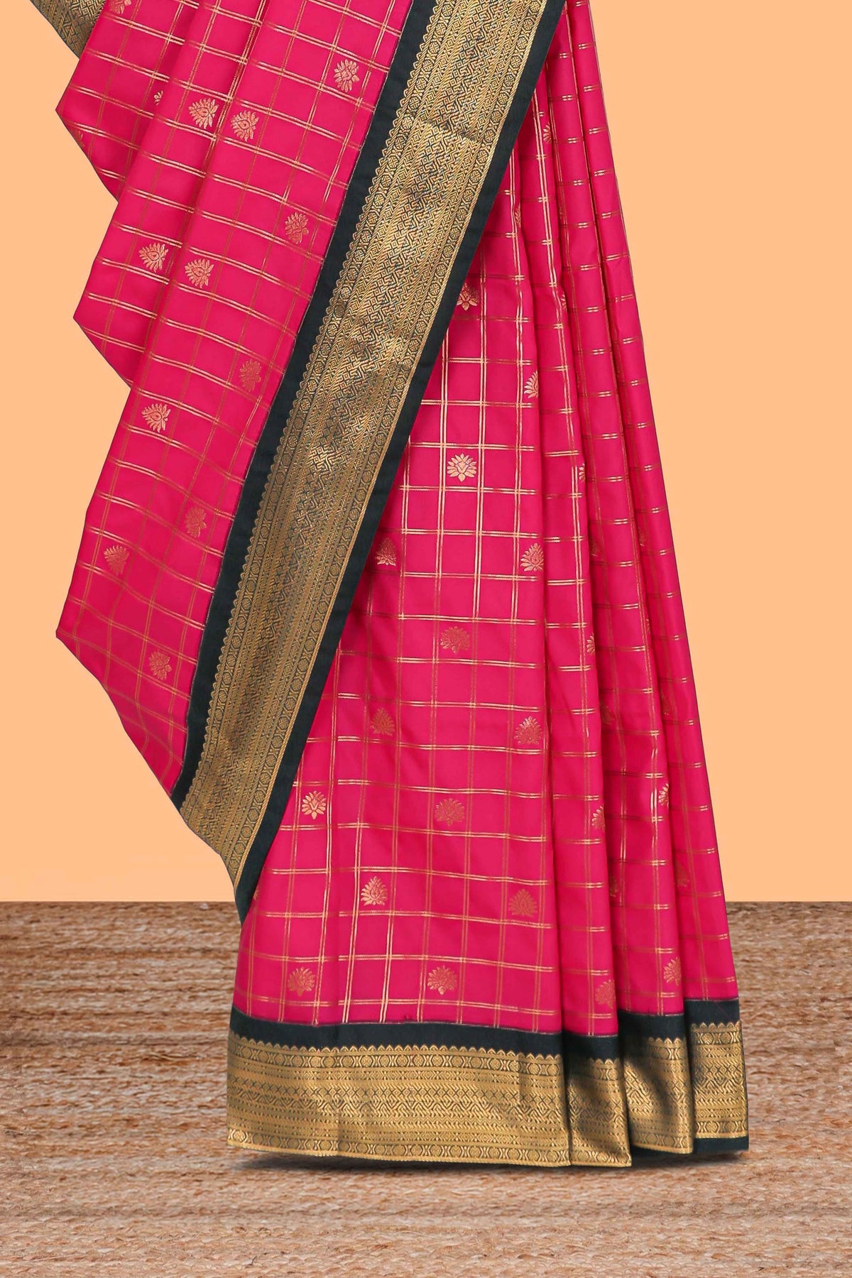 Pink checked floral motifs design semi soft silk saree with contrast border and striped blouse