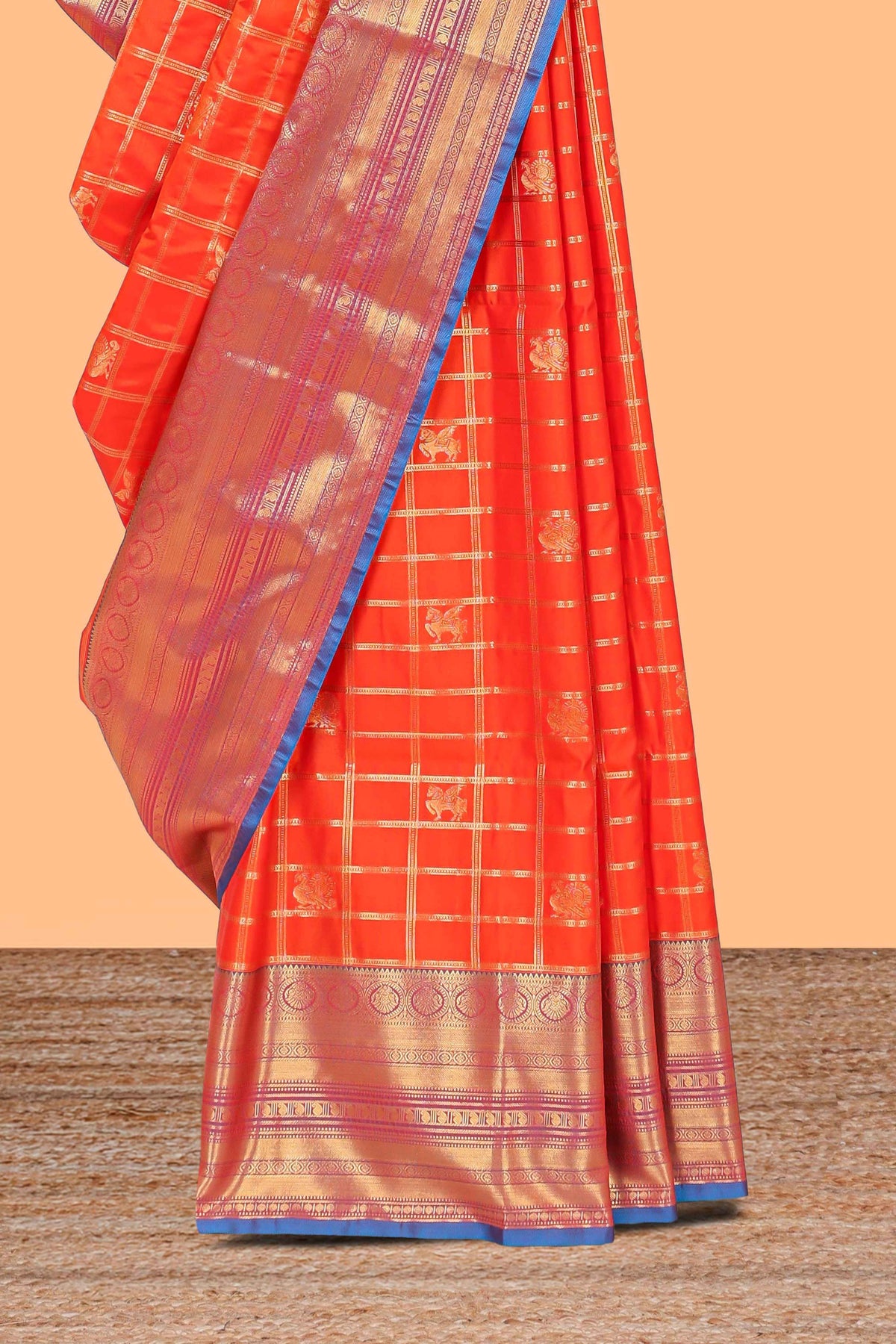 Orange checked peacock and unicorn motifs design semi soft silk saree with contrast border and blouse