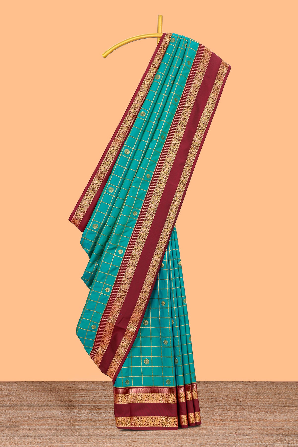 Viridian green checked floral zari motifs design semi soft silk saree with contrast border and blouse