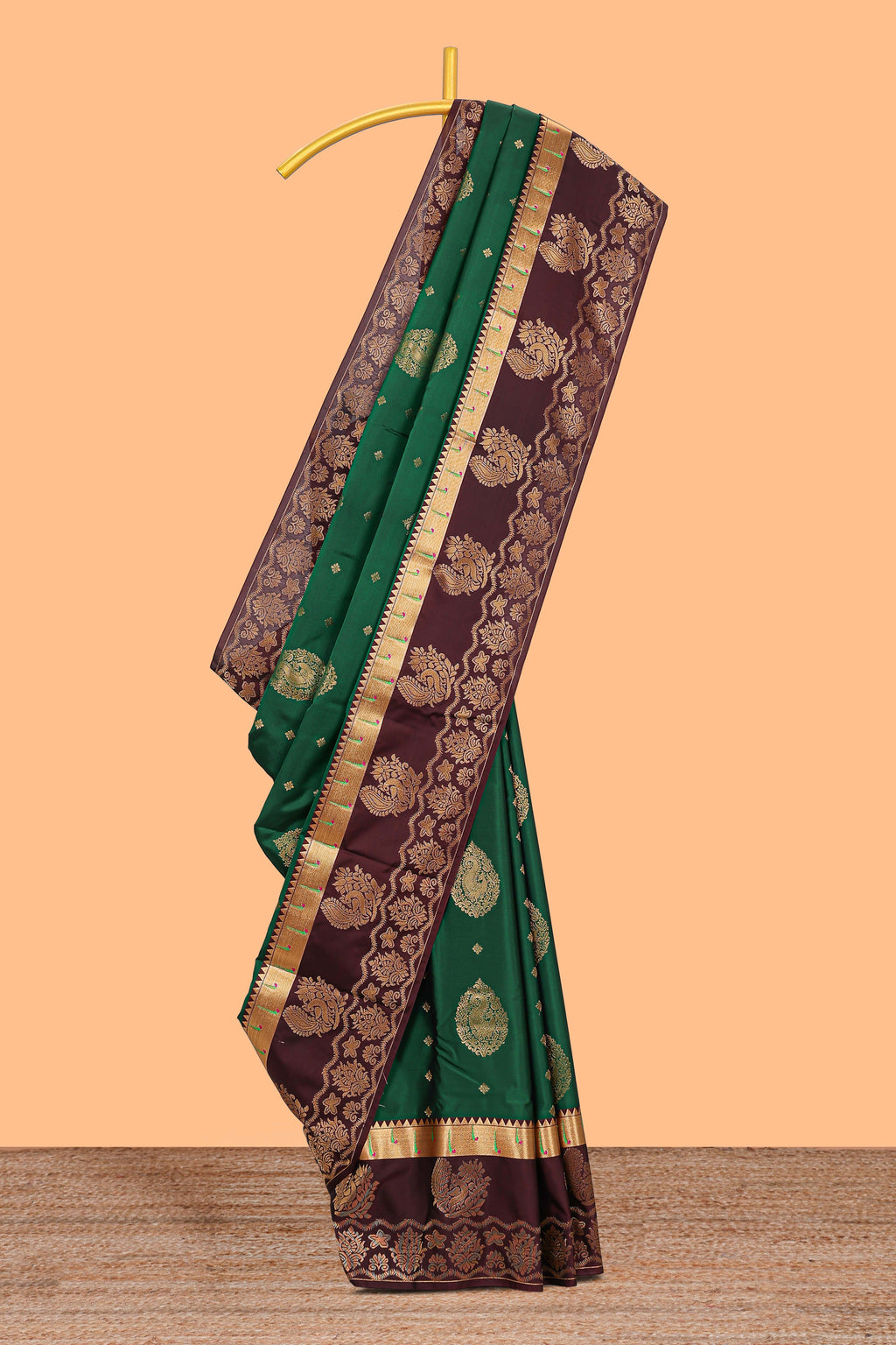 Green zari motifs design semi soft silk saree with contrast border and blouse