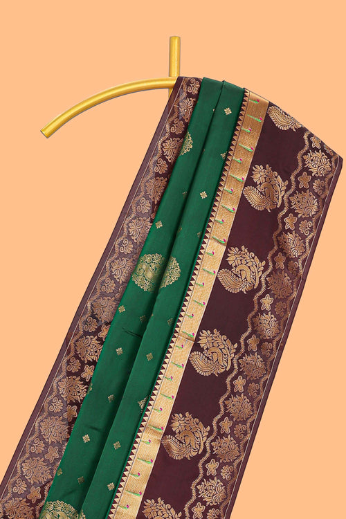 Green zari motifs design semi soft silk saree with contrast border and blouse