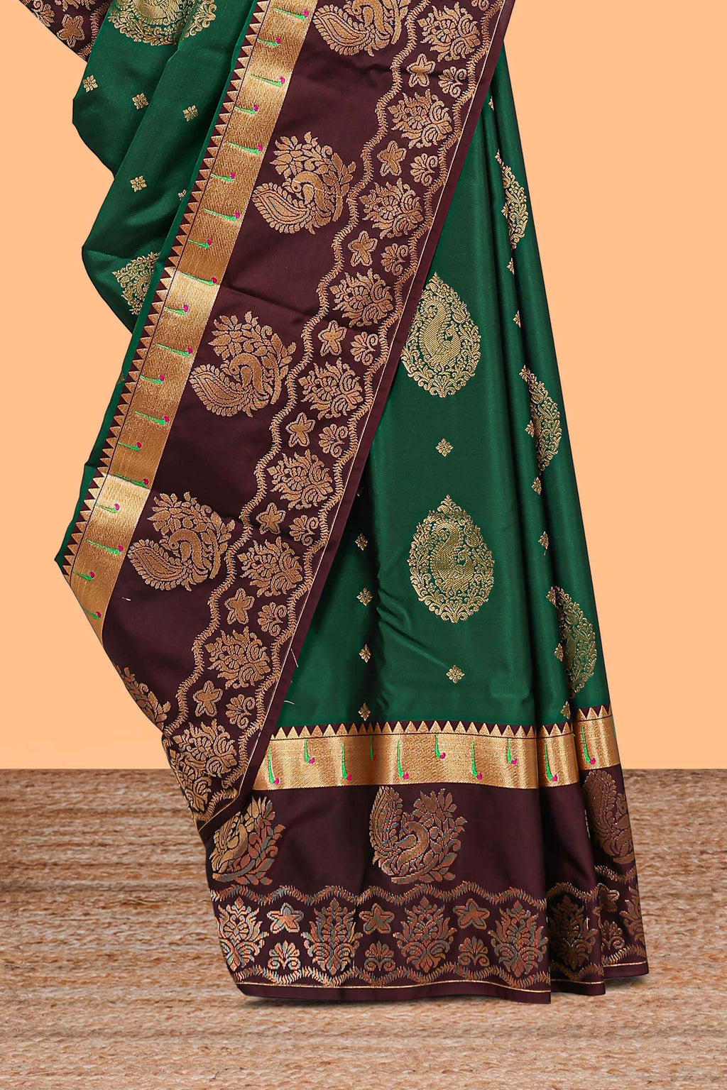 Green zari motifs design semi soft silk saree with contrast border and blouse