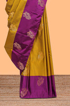 Mustard striped and peacock design semi soft silk saree with contrast border and blouse