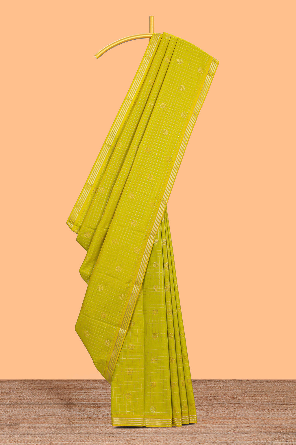 Green checked zari motifs design semi soft silk saree with self zari border and contrast blouse