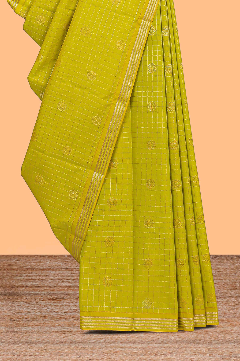 Green checked zari motifs design semi soft silk saree with self zari border and contrast blouse