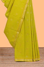 Green checked zari motifs design semi soft silk saree with self zari border and contrast blouse
