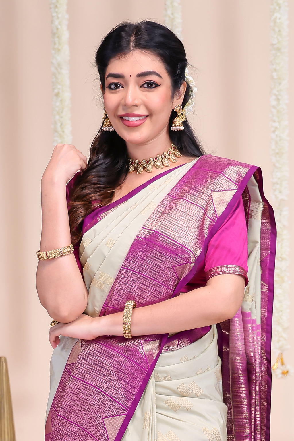 Off white geometric designed zari motifs semi soft silk saree with contrast zari border and motifs blouse