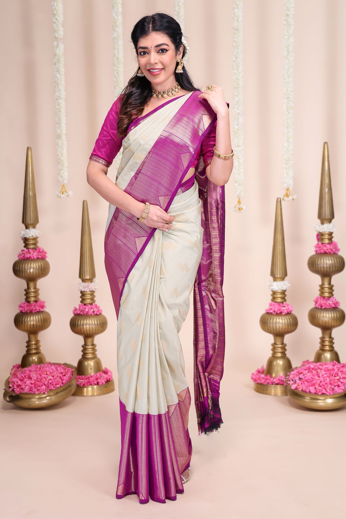 Off white geometric designed zari motifs semi soft silk saree with contrast zari border and motifs blouse