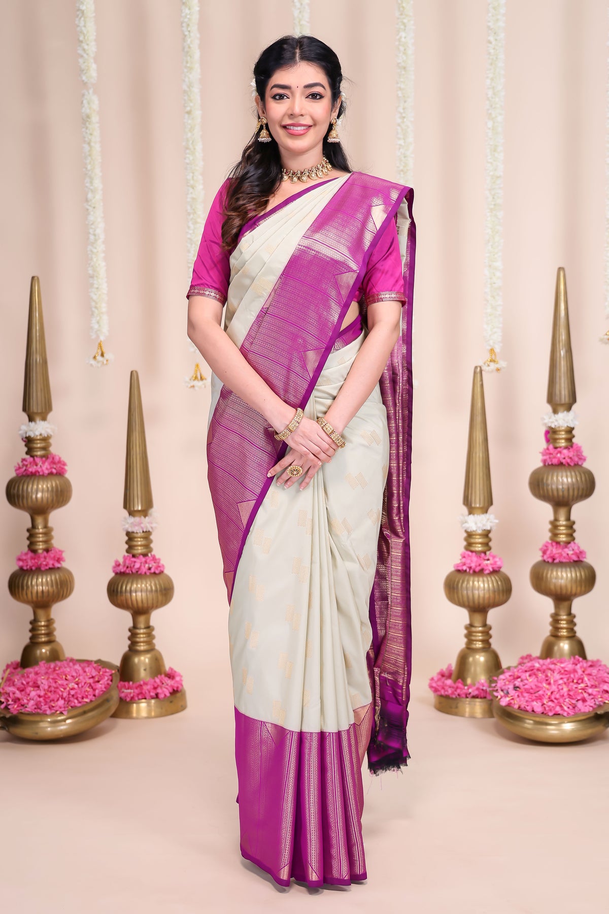 Off white geometric designed zari motifs semi soft silk saree with contrast zari border and motifs blouse