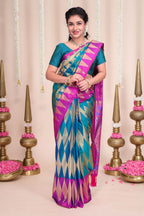Blue geometric designed semi soft silk saree with contrast zari border and contrast blouse