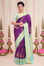 Purple butta designed semi soft silk saree with contrast zari border and contrast blouse