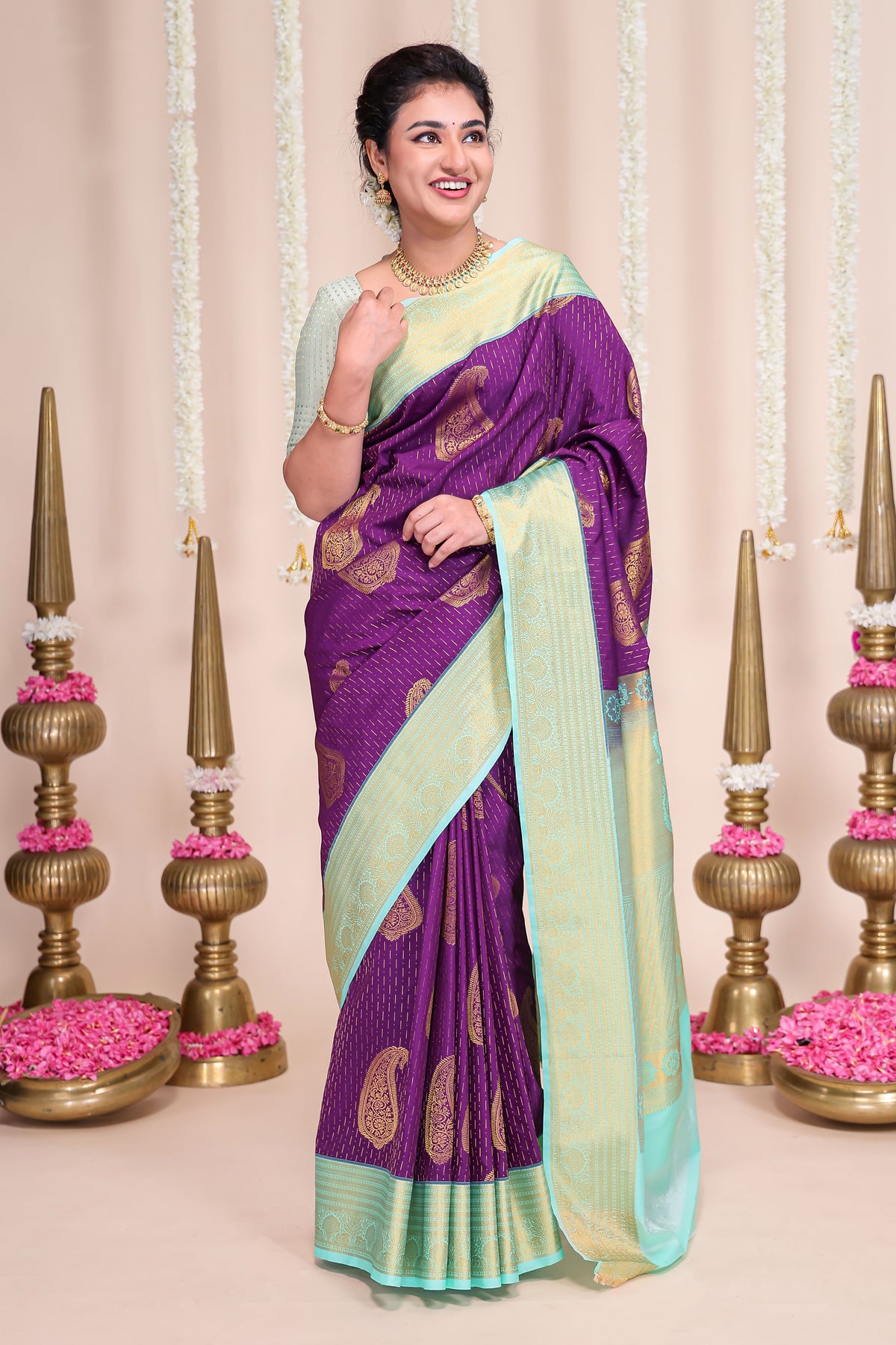 Purple butta designed semi soft silk saree with contrast zari border and contrast blouse
