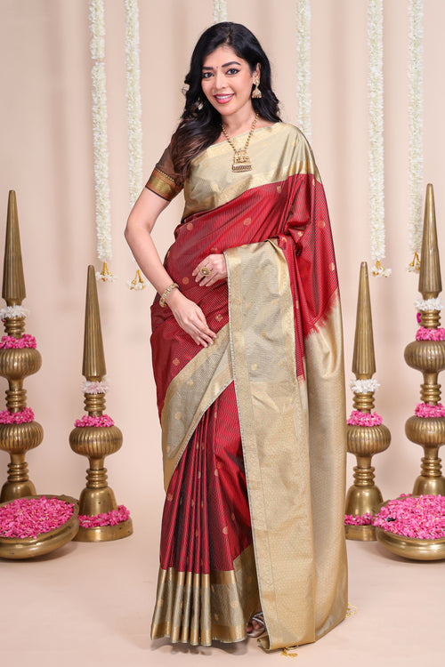 Rust shade striped butta designed semi soft silk saree with contrast zari border and contrast blouse