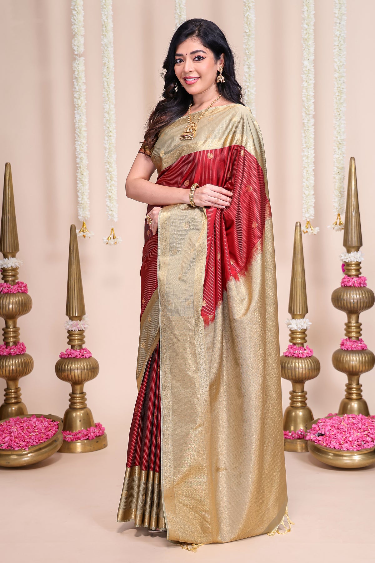 Rust shade striped butta designed semi soft silk saree with contrast zari border and contrast blouse