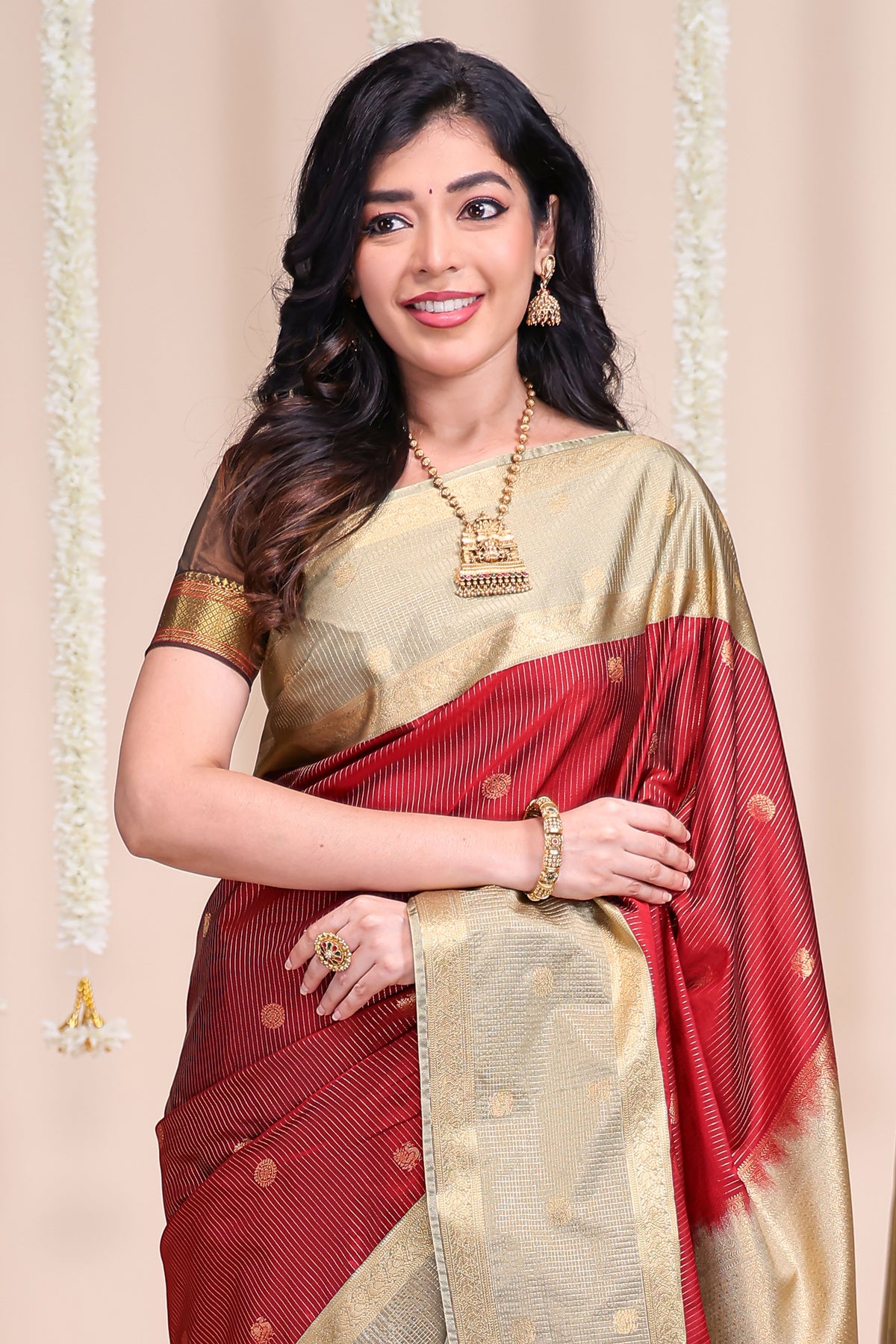 Rust shade striped butta designed semi soft silk saree with contrast zari border and contrast blouse