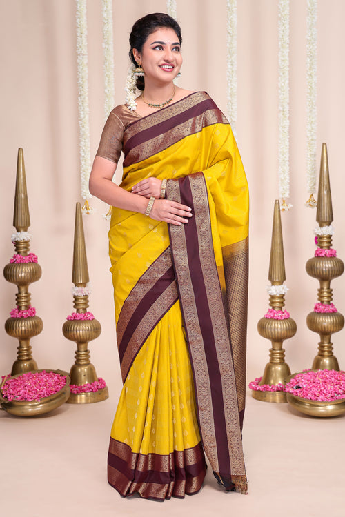 Yellow striped zari motifs designed semi soft silk saree with contrast bentex zari border and blouse