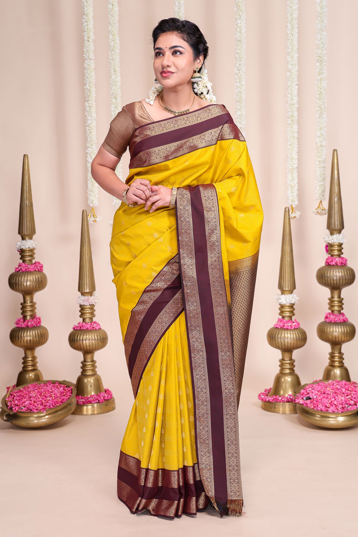 Yellow striped zari motifs designed semi soft silk saree with contrast bentex zari border and blouse