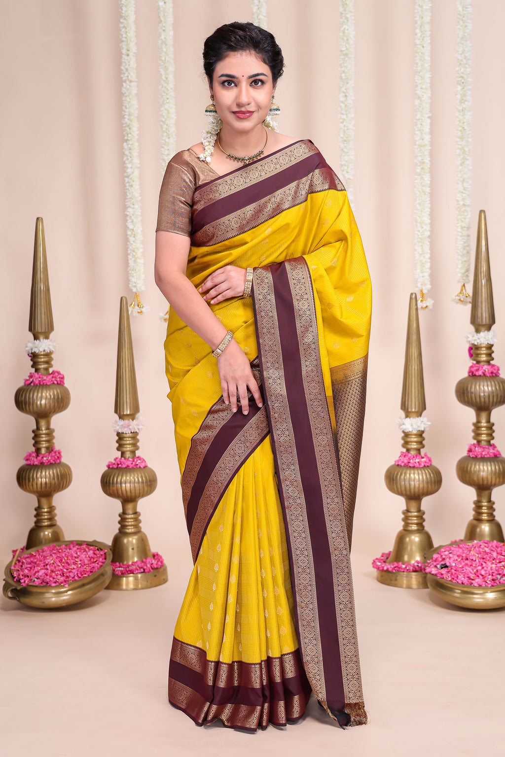 Yellow striped zari motifs designed semi soft silk saree with contrast bentex zari border and blouse