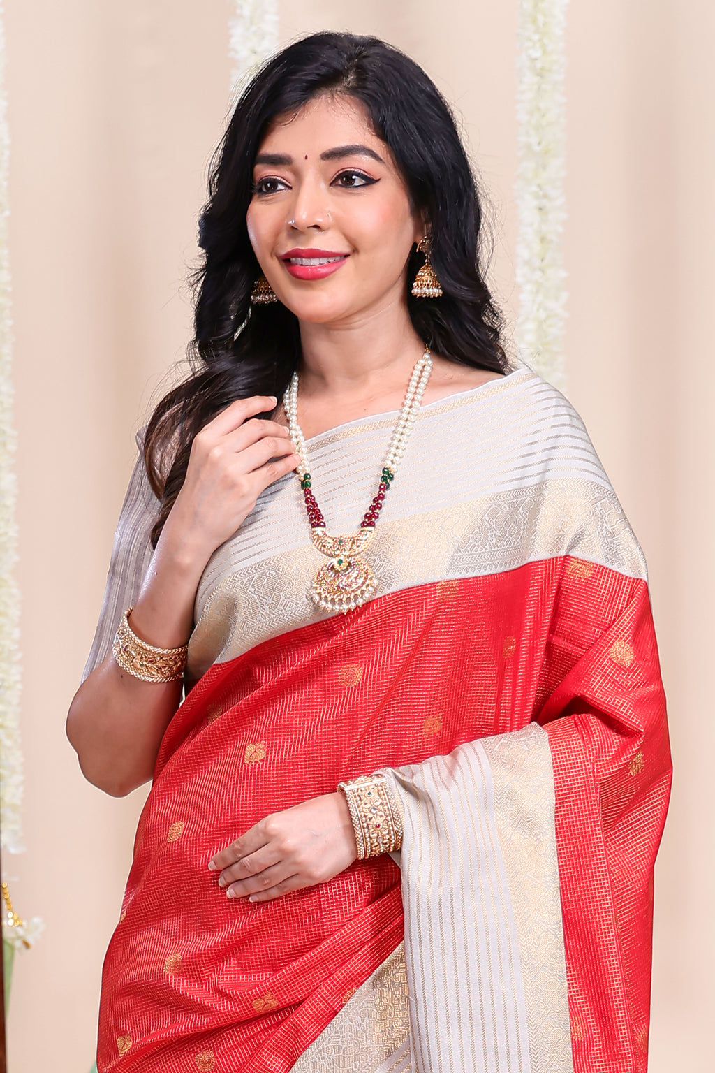 Red checked peacock zari motifs designed semi soft silk saree with contrast zari border and contrast blouse