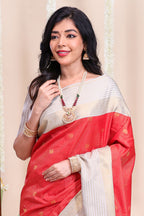 Red checked peacock zari motifs designed semi soft silk saree with contrast zari border and contrast blouse