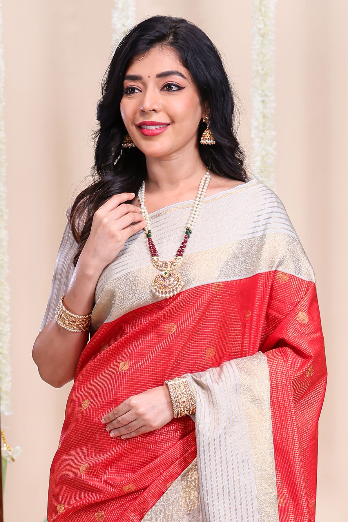 Red checked peacock zari motifs designed semi soft silk saree with contrast zari border and contrast blouse