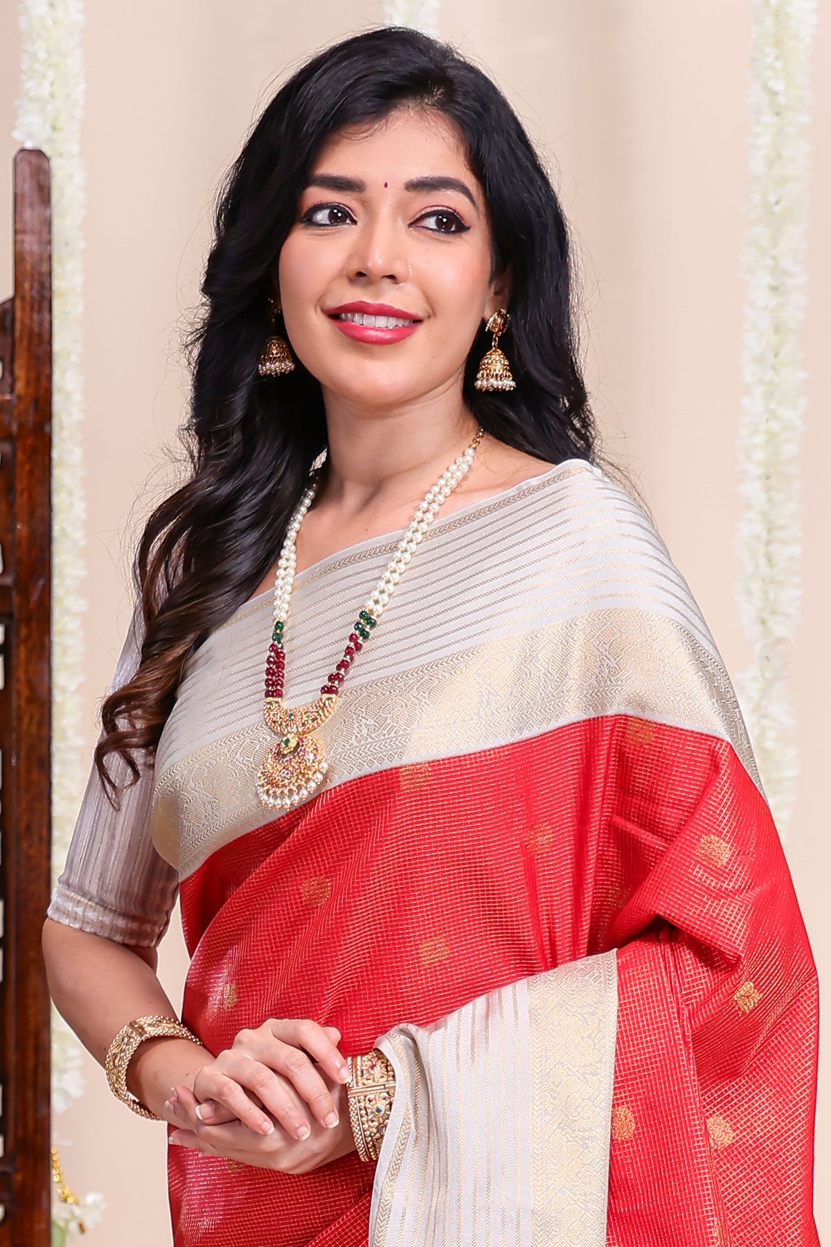 Red checked peacock zari motifs designed semi soft silk saree with contrast zari border and contrast blouse