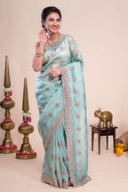 Blue floral motifs chiffon designer saree with self scallop border and matching blouse