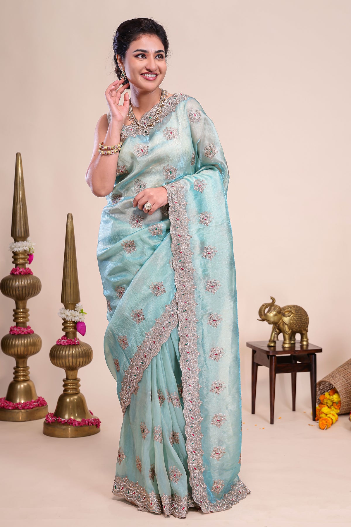Blue floral motifs chiffon designer saree with self scallop border and matching blouse