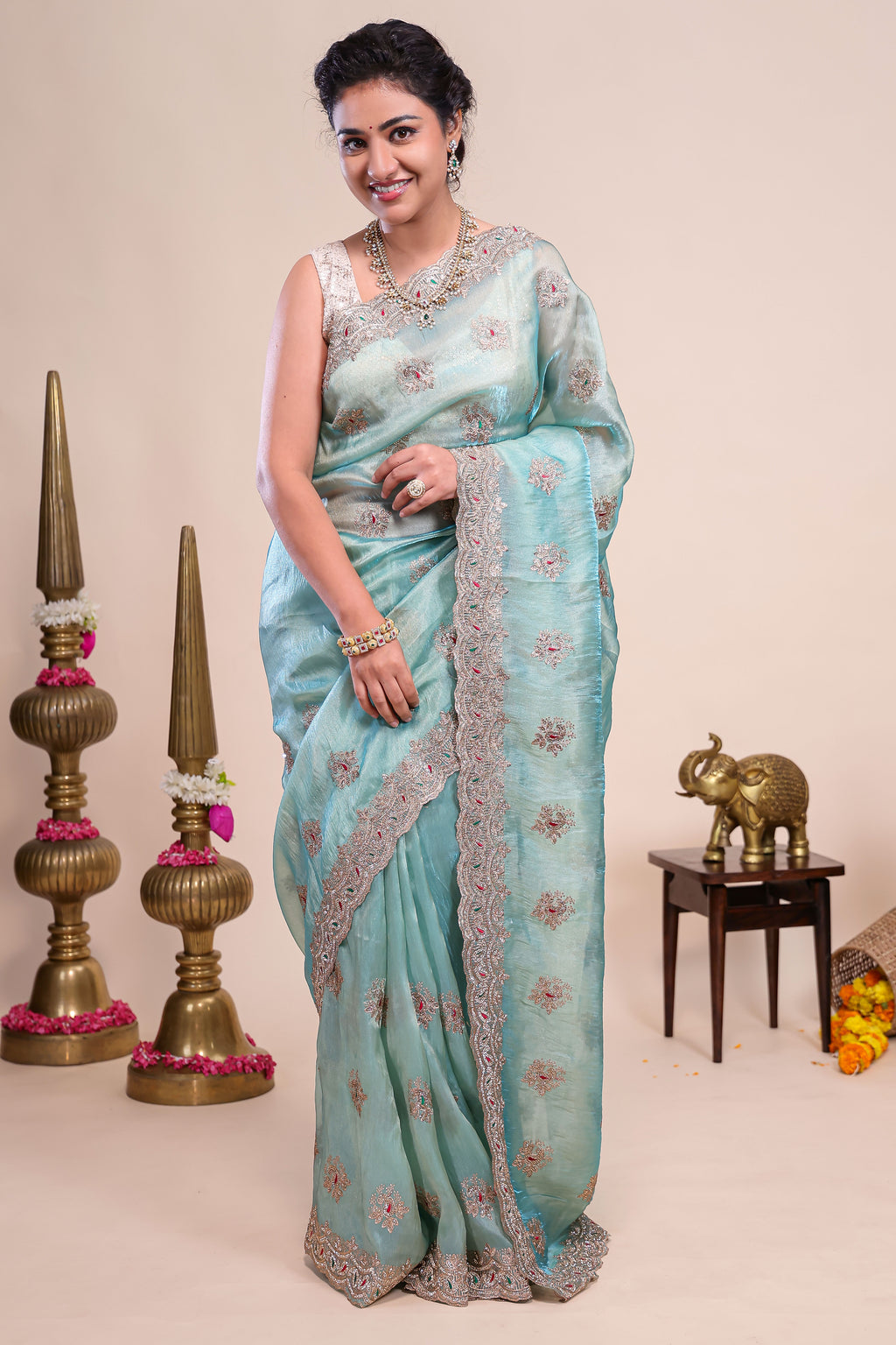 Blue floral motifs chiffon designer saree with self scallop border and matching blouse