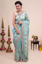 Blue floral motifs chiffon designer saree with self scallop border and matching blouse