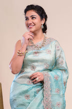 Blue floral motifs chiffon designer saree with self scallop border and matching blouse